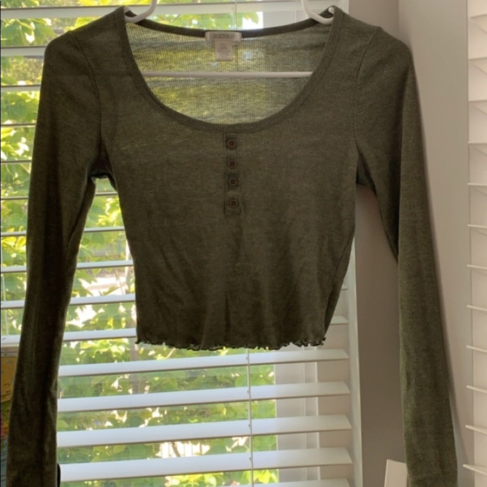 Olive green ruffled bottom buttoned top